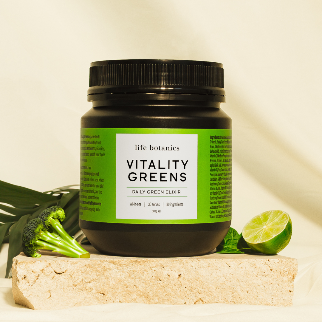 Front view of the 300g Life Botanics Vitality Greens pack against a light orange-gold background.